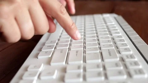 Slowly typing on keyboard Stock-Footage 76680530