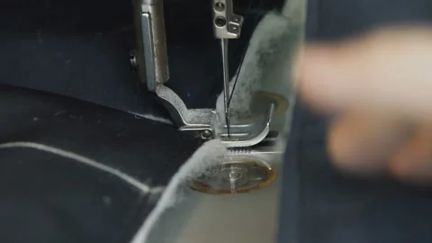Slowly view of stitching a jacket with sewing machine 스톡 동영상 90398338