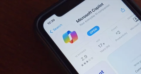 Slowly zoom out Microsoft Copilot app seen in App Store on iPhone screen Video stock 260276583