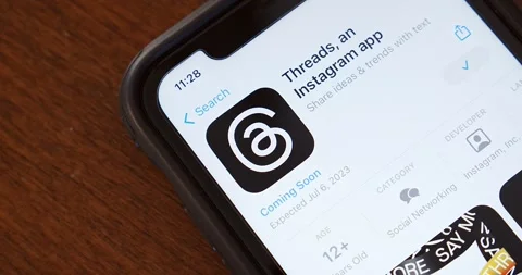 Slowly zoom out Threads app page seen in App Store on an iPhone Stock Footage 245417562