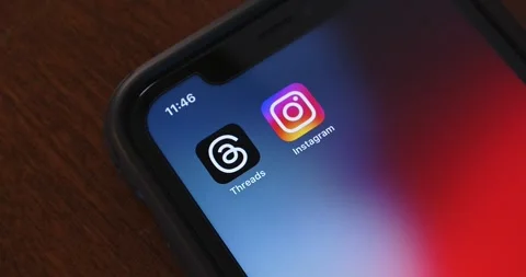 Slowly zoom out Threads app and Instagram icons seen in an iPhone Stock Footage 245417605