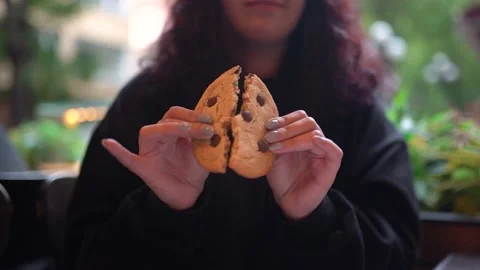 Slowmo Close Up, Breaking Chocolate Chip Cookie In Half Revealing Inside Stock Footage 180836715