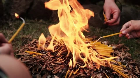 Slowmo closeup of candles burning in a campfire Stock Footage 241007548