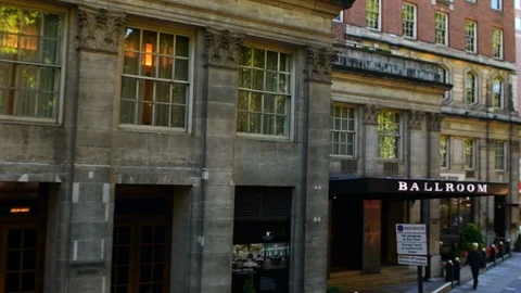 Slowmo high angle on Park Lane with Mini car dealership in Mayfair, London Stock Footage 107885978