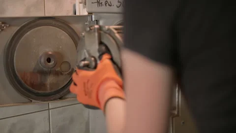 Slowmo: Laboratory Technician Puts Bitumen Sample Inside Round Cleaning Machine Stock Footage 138804807