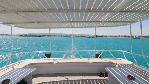 SLOWMO - Looking back from front deck of boat on ocean Stock Footage 164040231