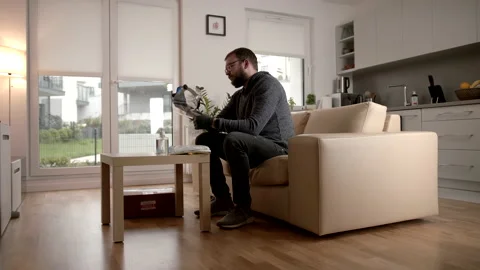 Slowmo: Looking At A Face Shield After Unpacking A Pandemic Package At Home Stock Footage 142863203