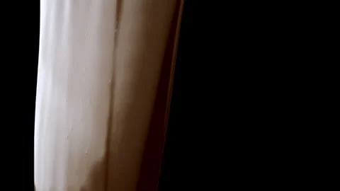 Slowmo Orange Slices Fall through Wall of Pouring Melted Chocolate Stock Footage 148489378