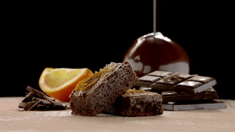 Slowmo Packshot of Brownie Bars with Oranges in the Background Stock Footage 148490086