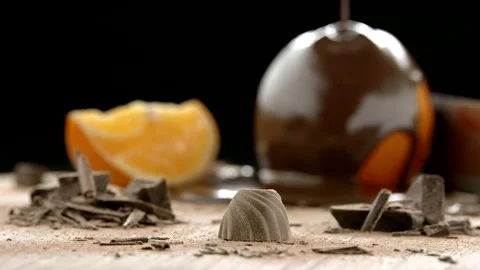 Slowmo Packshot of Praline with Oranges in the Background Stock Footage 148489888
