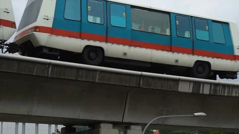 Slowmo Self Driving Light Rail LRT Train Driving on Elevated Tracks in Singapore Stock Footage 114490381