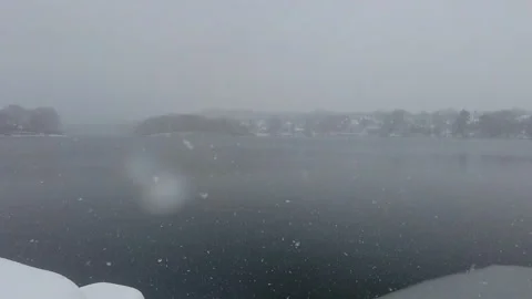 SLOWMO - SNOW AT POND Stock Footage 187735885