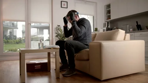 Slowmo: Wearing A Face Shield After Unpacking A Pandemic COVID-19 Package Stock-Footage 142863245