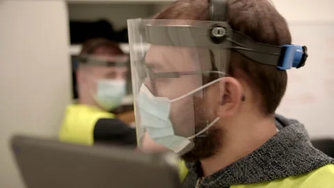 Slowmo: Workers in Protective Face Masks Checking Inventory in Fulfilment Center Stock Footage 142862634