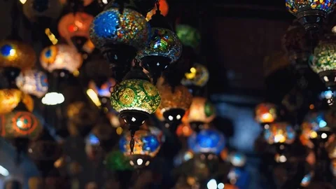 Slowmotion. Camera moving throught traditional turkish lamps at night time Stock Footage 105395451