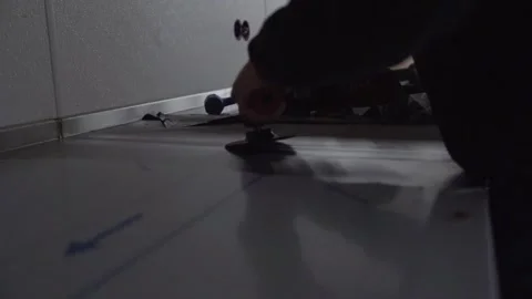 Slowmotion close up view of a grinder polishing after welding inside a Stock Footage 270213697