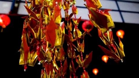 Slowmotion Crane Origami Blowing in wind Stock Footage 83487035