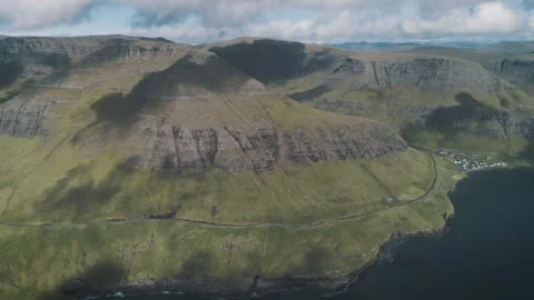Slowmotion Drone Aerial Footage of green nature and the ocean in Faroe Islands Stock Footage