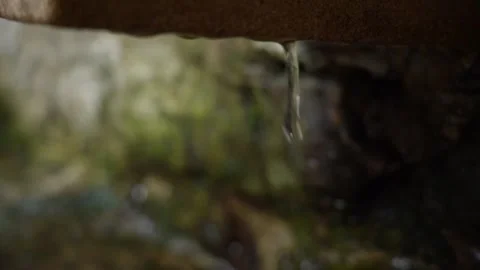 Slowmotion Drops of Water Flows Down and Slowly Falls From Tap Stock Footage 248828894