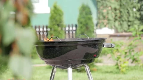 Slowmotion of a flame in a barbecue grill. Handheld shot Stock Footage 68175975