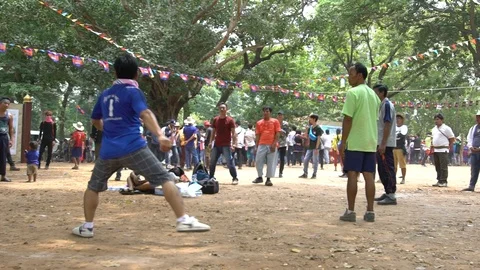 Slowmotion group of Cambodians trying not to let shuttlecock touch the floor-Dan Stock Footage 119056922