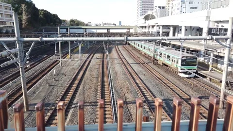 Slowmotion Landscape view from above view to Japan railway train JR trackway  Stock Footage 221880069