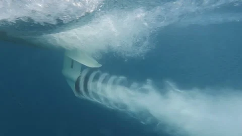 Slowmotion lateral close up shot of boat propeller in dea blue dea during Stock Footage 150388309