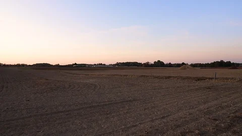Slowmotion. Long shot. View of the field from the car window. Stock Footage 128659399