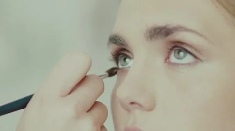 Slowmotion: Make-up work. Close-up face of a model Stock Footage 68042142