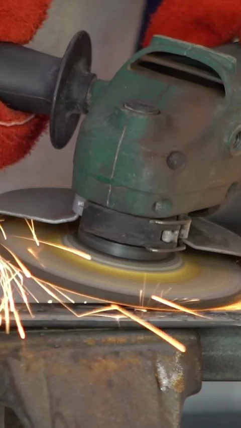 Slowmotion of metal processing with a man using angle grinder to cleaning Stock Footage 312118547