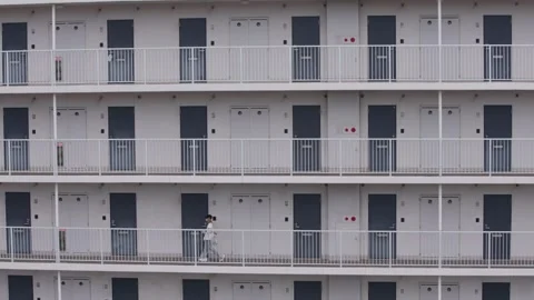 Slowmotion of modern apartment building facade with repeating balconies Japan Stock Footage 331189136