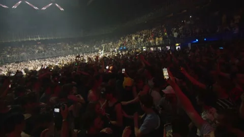 Slowmotion moshpit people dancing big stage event festival party Stock Footage 168990163