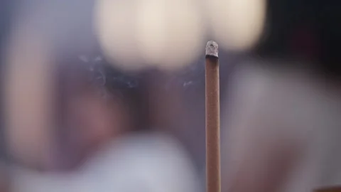 Slowmotion motion of people walking behind incense altar inside Taiwanese temple Stock Footage 313950544