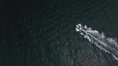 Slowmotion of a motorboat moving through the waves. Stock Footage 129100096