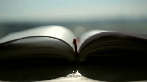 Slowmotion. Notebook for studying on the desk in the morning sun Stock Footage 104872376