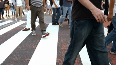 Slowmotion - People walking on the crosswalk Stock Footage 88992640