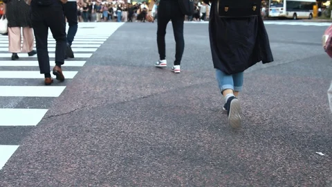Slowmotion - People walking on the crosswalk Stock Footage 88998372