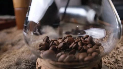 Slowmotion pouring Roasted Coffee beans. Видео 297388638