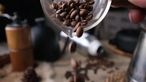 Slowmotion pouring Roasted Coffee beans. Stock Footage 297388682