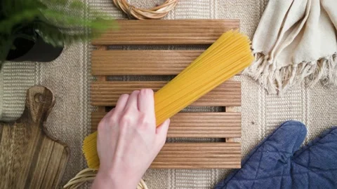 Slowmotion of raw pasta spreading with cozy table background Stock Footage 185822173