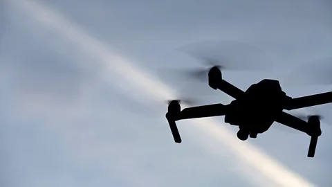 Slowmotion recording from below a drone with the sky as background Stock Footage 128956253