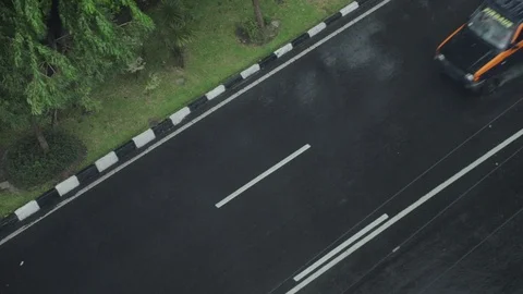 SLOWMOTION Road Traffic on Heavy Rain, Surabaya East Java, Indonesia Stock Footage 129374147