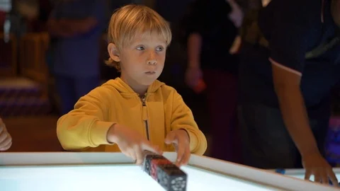 Slowmotion shot of a little boy visiting a science museum for children. He plays Stock Footage 102487155