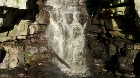 Slowmotion shot of a waterfall under sunlight Stock Footage 224966368