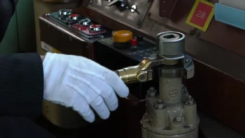 Slowmotion of train engine driver inside Japanese Kyoto local train cabin. Japan Video stock 165440549
