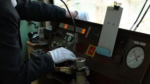 Slowmotion of train engine driver inside Japanese Kyoto local train cabin. Japan Video stock 165440614