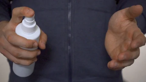 Slowmotion Using Disinfect Product Stock Footage 128155075