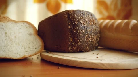 Slowmotion of Variety of bread on the table in kitchen Stock Footage 51000903