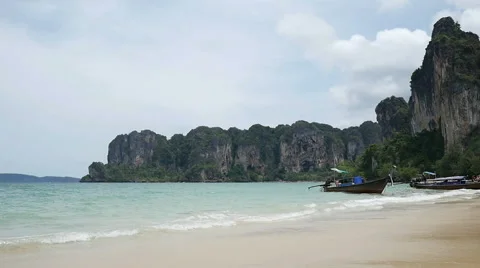 Slowmotion video of waves breaking to the beautiful tropical sandy beach at Stock Footage 68535988
