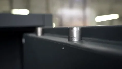 Slowmotion. View from above. The bolt slides out of the large metal door. Stock Footage 196879564